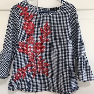 Gingham blouse with red embroidered flowers